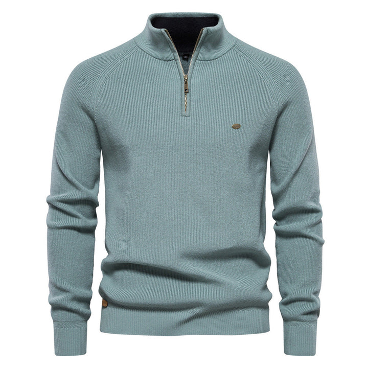 Pull homme demi-zippé noir, coupe moderne. Vêtement élégant et confortable pour l'automne. Style homme chic.