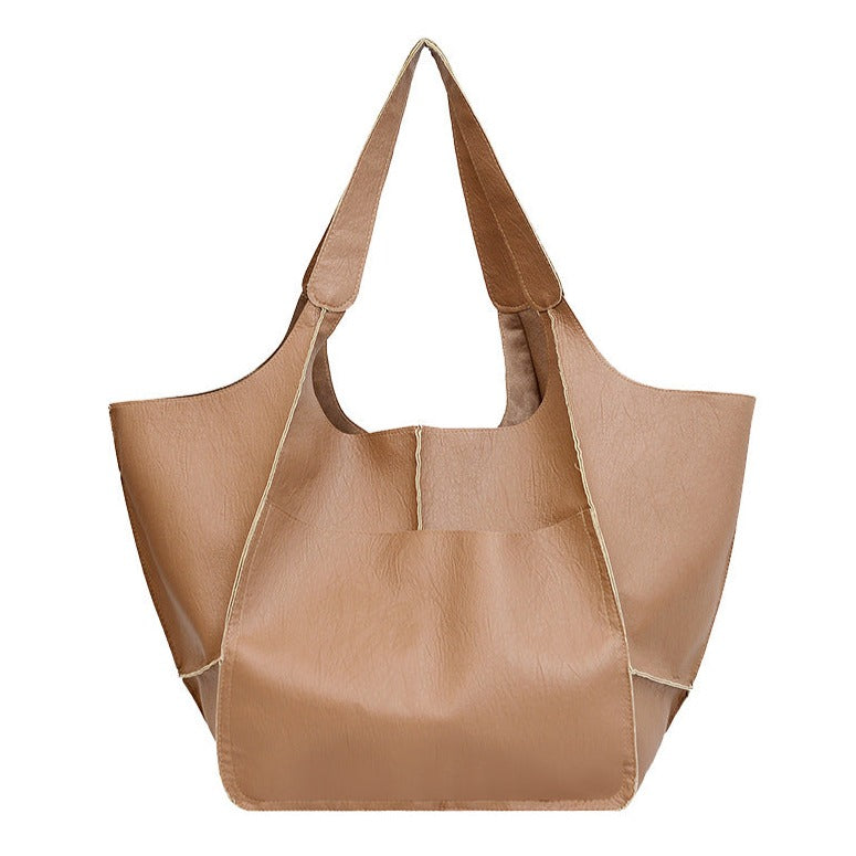 Sac à main élégant en cuir vegan pour femme, accessoire mode éthique et chic, parfait pour toute occasion.