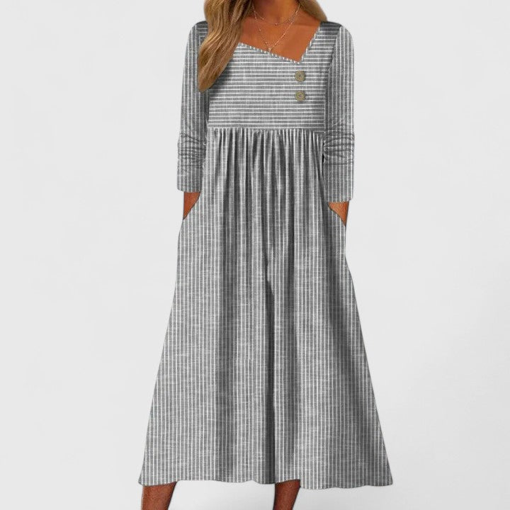 Robe midi élégante femme, style Cleomarie sophistiqué, coupe asymétrique pour bureau ou soirée chic.