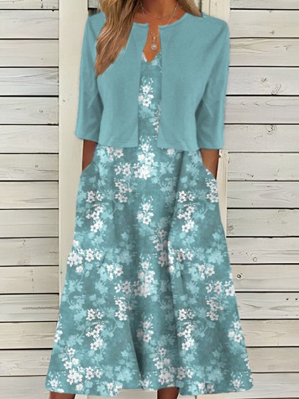 Détail de la robe midi fleurie pour femme, imprimé floral mode, élégante et fluide, look estival/printanier, confort.