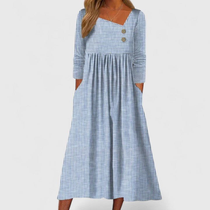 Tenue mode féminine : robe midi Cleomarie chic, coupe asymétrique élégante, parfaite pour tout événement.