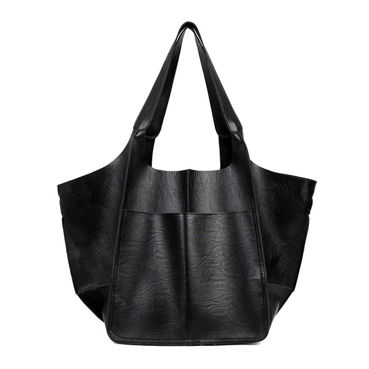 Sac bandoulière moderne et polyvalent en cuir vegan, accessoire femme élégant et éthique pour un look parfait.