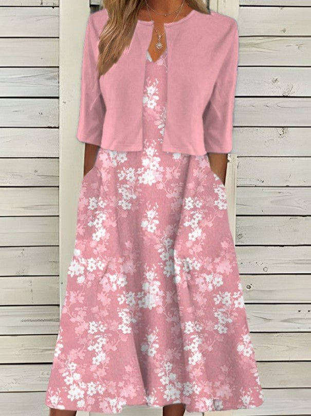 Femme élégante porte une robe midi fleurie, coupe fluide, parfaite pour l'été et le printemps, style mode confortable.