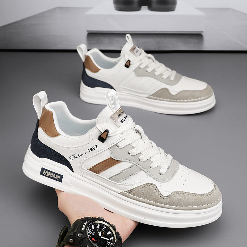 Paire de baskets urbaines homme, bandes latérales classiques contrastantes, parfaites pour un usage quotidien.