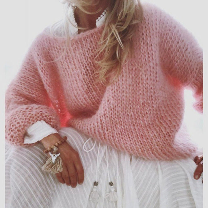 Pull tricoté maille épaisse pour femme. Confortable et chaud, parfait pour affronter le froid avec style.