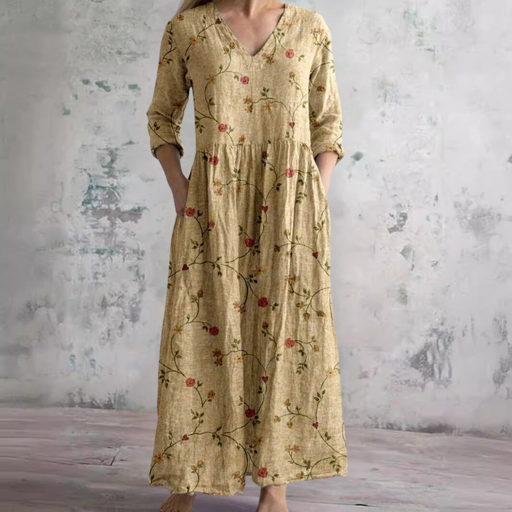 Robe d'été maxi à fleurs, coupe fluide et décontractée. Offre une élégance estivale et un grand confort pour femme.