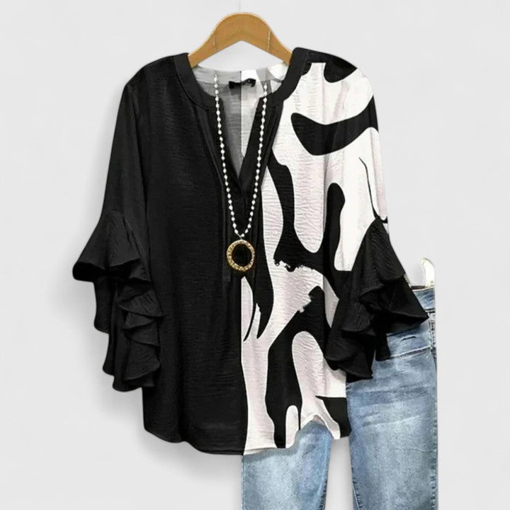 Blouse femme élégante à motif fleuri, un chemisier chic pour toutes les occasions estivales.