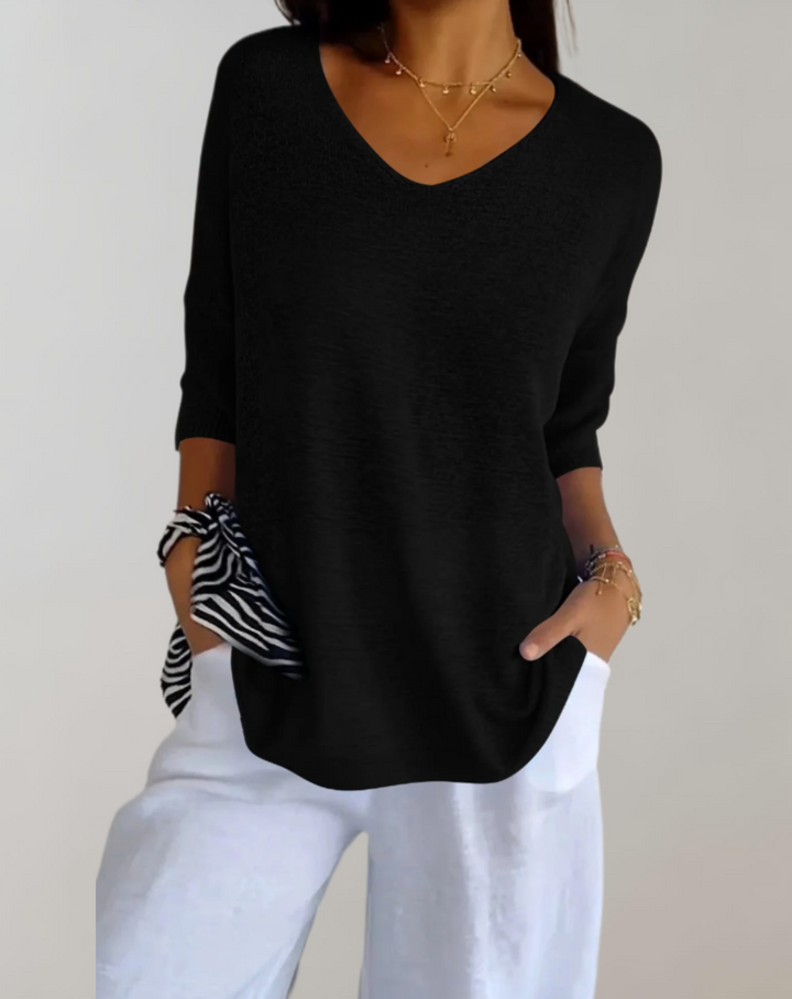 Pull femme Marise. Vêtement décontracté et élégant à col V, parfait avec un jean pour un look chic.