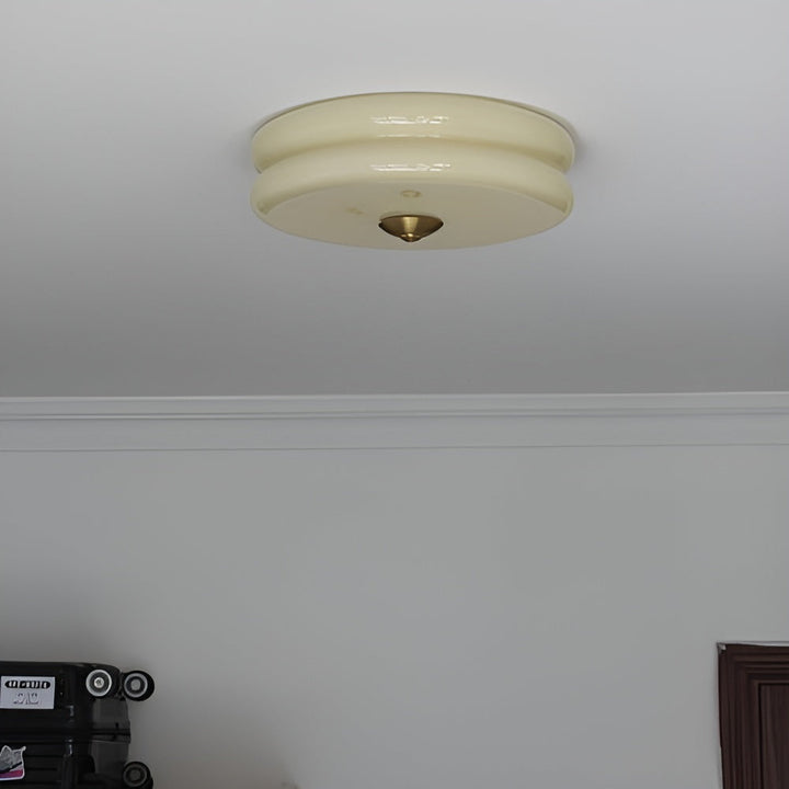 Éclairage de plafond LED crème, design rond Bauhaus, pour un luminaire moderne.