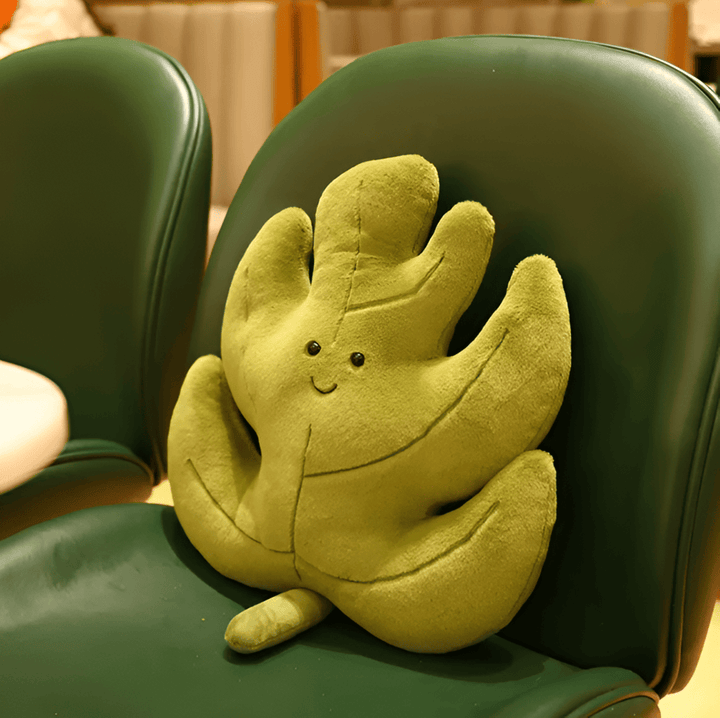 Coussin velours feuille, décoratif et confortable, parfait pour un coin lecture ou une chambre.