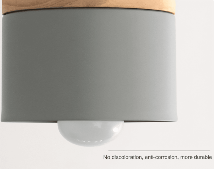 Détail de la suspension cylindrique moderne, finition élégante et design épuré.