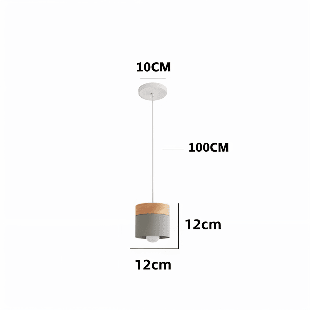 Suspension cylindrique scandinave illuminant un intérieur moderne avec une lumière douce.
