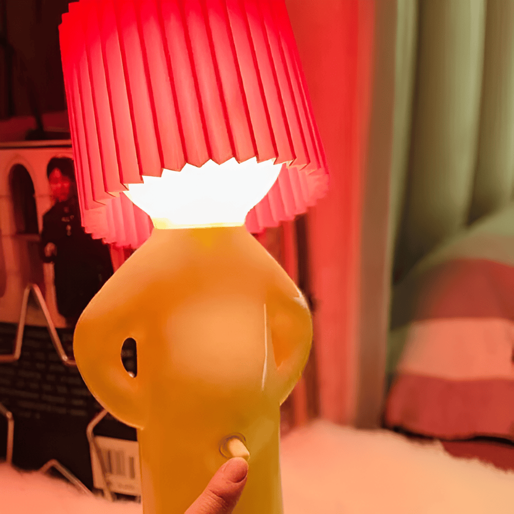 Lampe de table LED moderne au design figuratif distinctif, parfait pour une décoration unique.