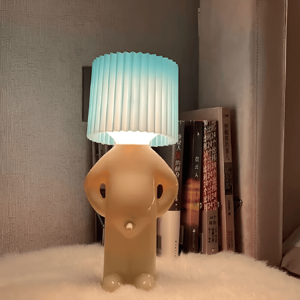 Lampe de table LED avec figure artistique, un luminaire décoratif qui offre une lumière douce.