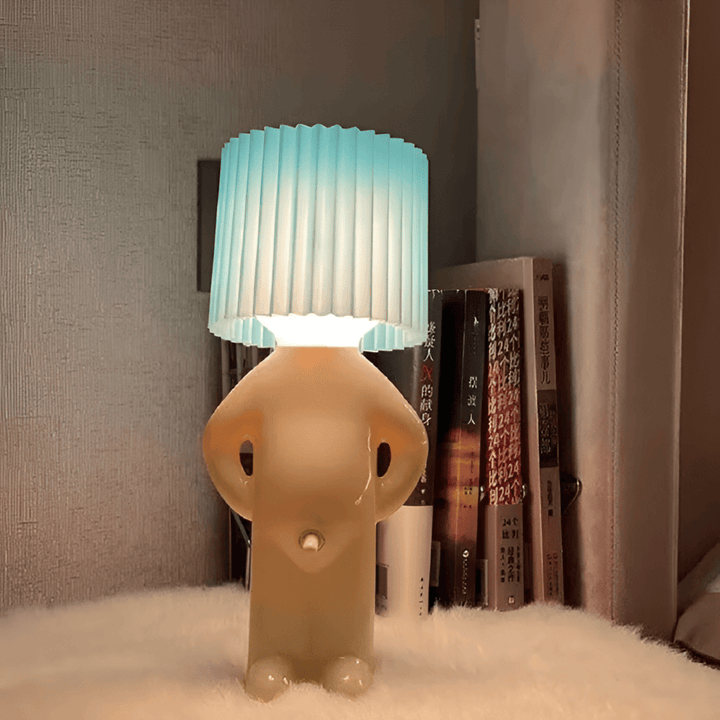 Lampe de table LED avec figure artistique, un luminaire décoratif qui offre une lumière douce.