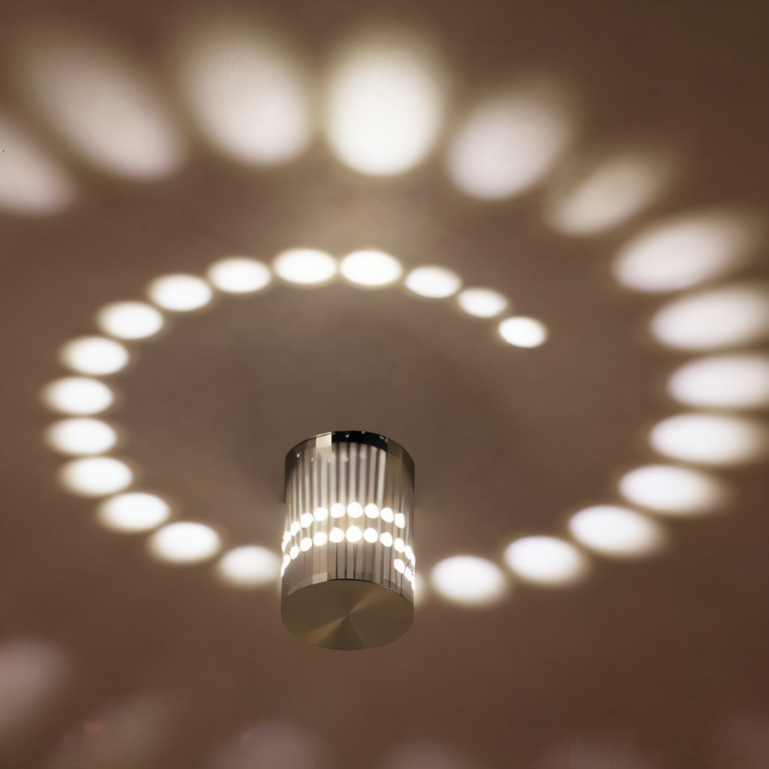 Applique LED cylindrique à effet spirale, lumière moderne pour ambiance intérieure unique.