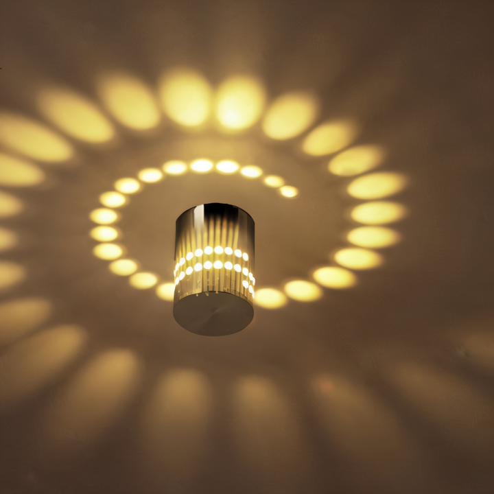 Applique murale LED cylindrique, effet spirale pour un éclairage intérieur moderne et stylé.