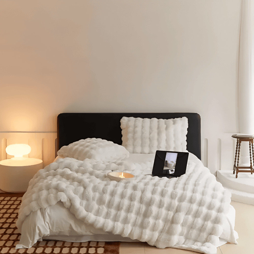 Couverture plaid ultra douce à carreaux, parfaite pour confort et décoration de chambre.