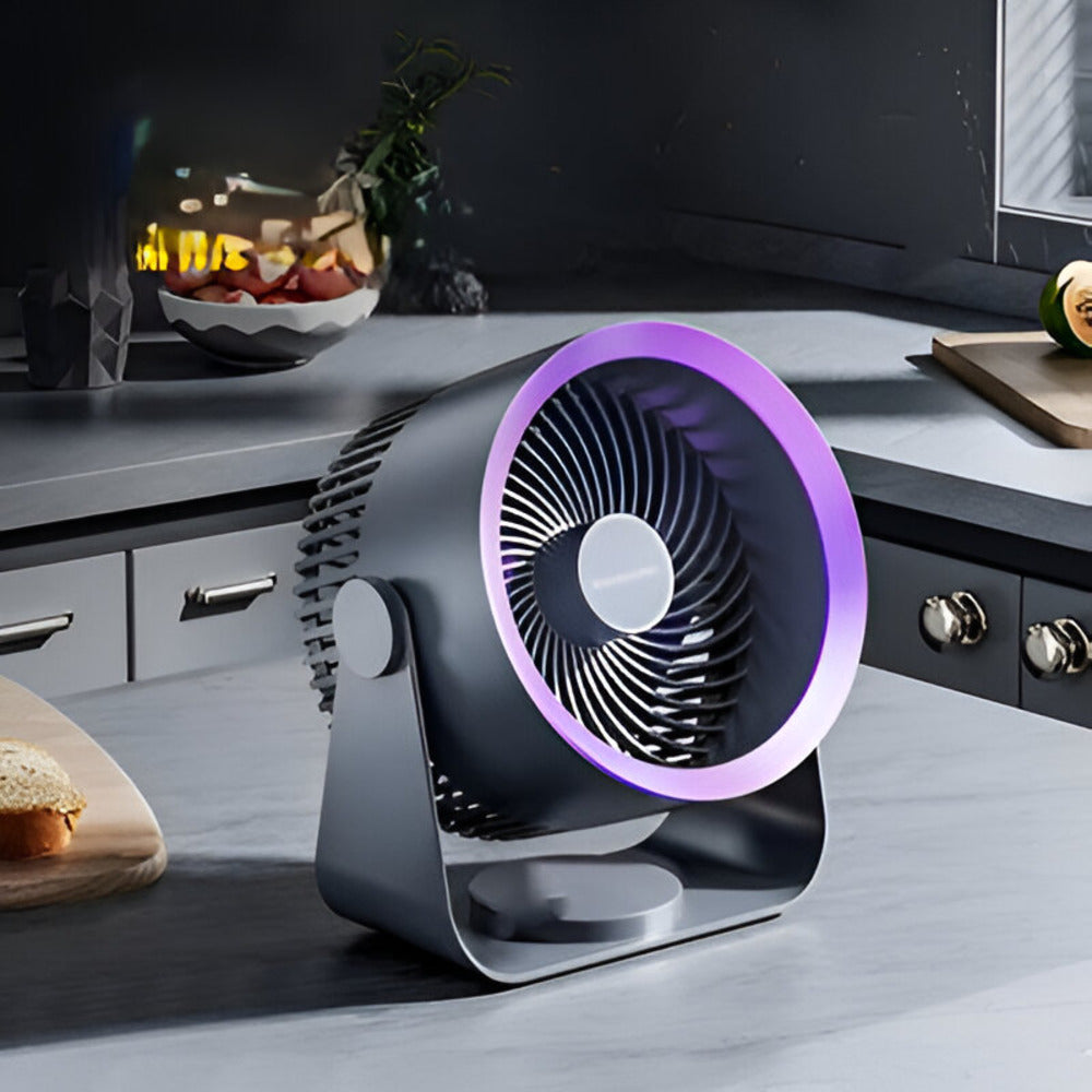 Ventilateur oscillant portable, offre une fraîcheur bienvenue sur table ou comptoir, facile à déplacer.