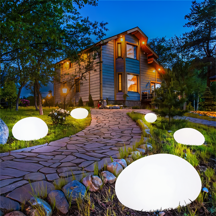 Luminaire extérieur solaire LED, design pierre, résistant intempéries pour jardin.