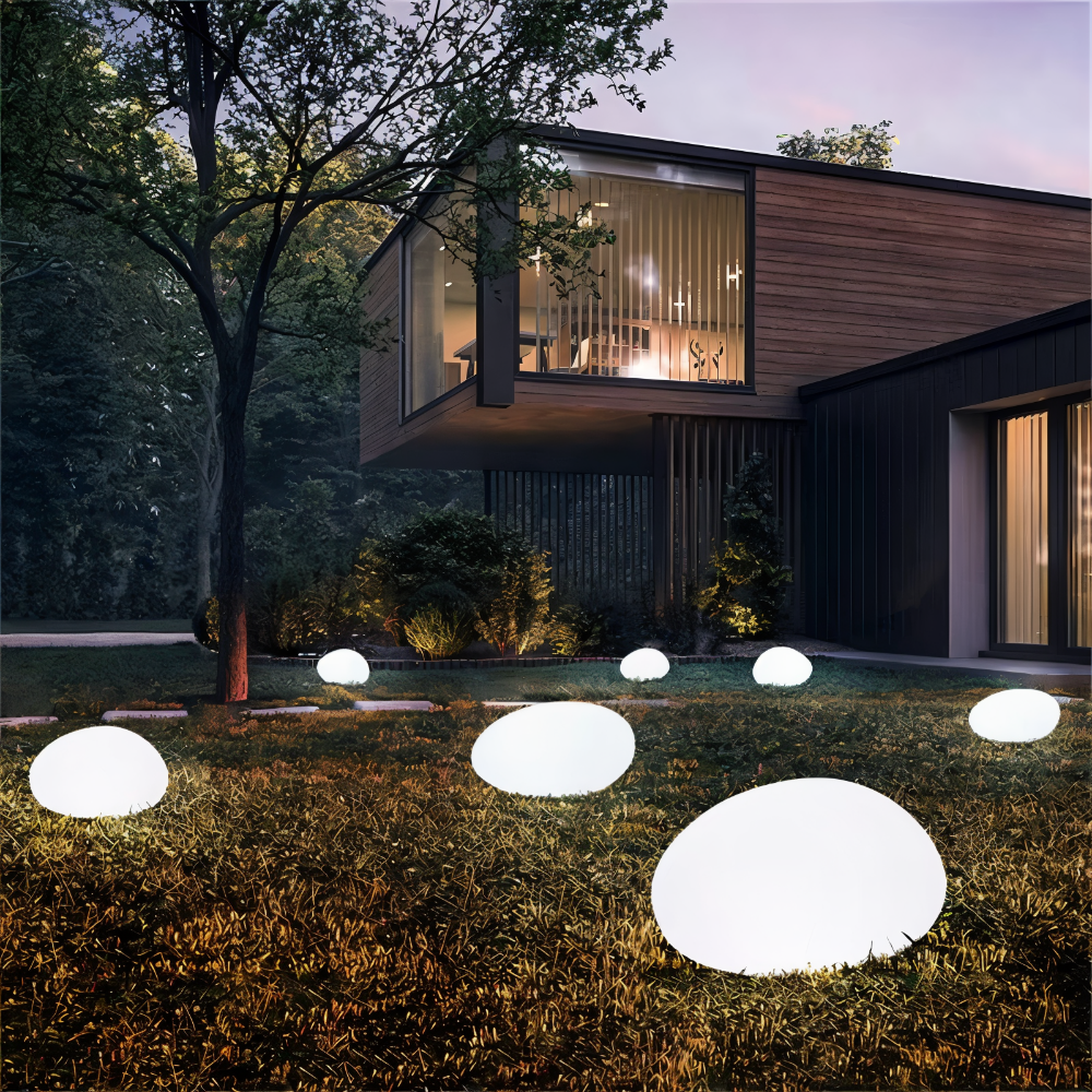 Lampe jardin solaire LED, effet pierre grise, lumière douce pour une ambiance chaleureuse.