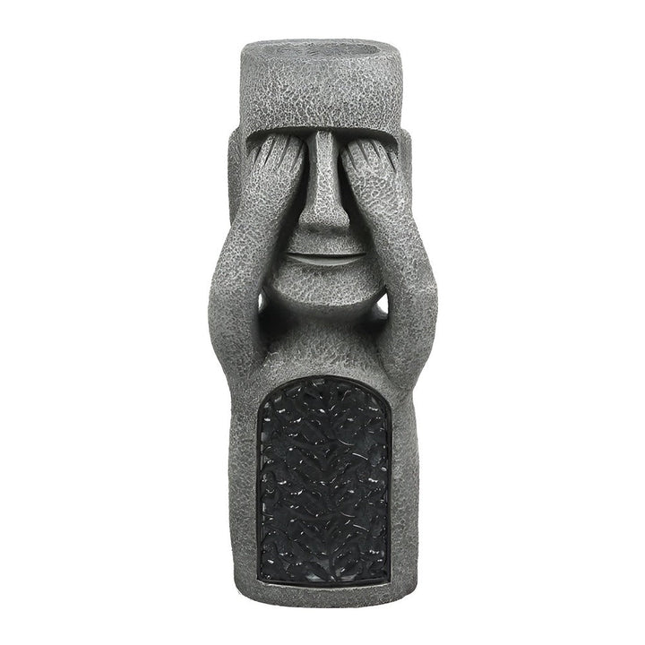 Détail d'une figurine Moai solaire, éclairage LED intégré pour une décoration de jardin nocturne captivante.