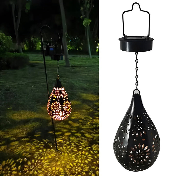 Lanterne solaire extérieure en métal sur terrasse, crée une ambiance chaleureuse et un éclairage d'appoint.