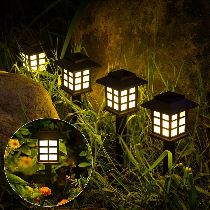 Lampes solaires LED résistant intempéries, éclairage extérieur design pour jardin et chemin.