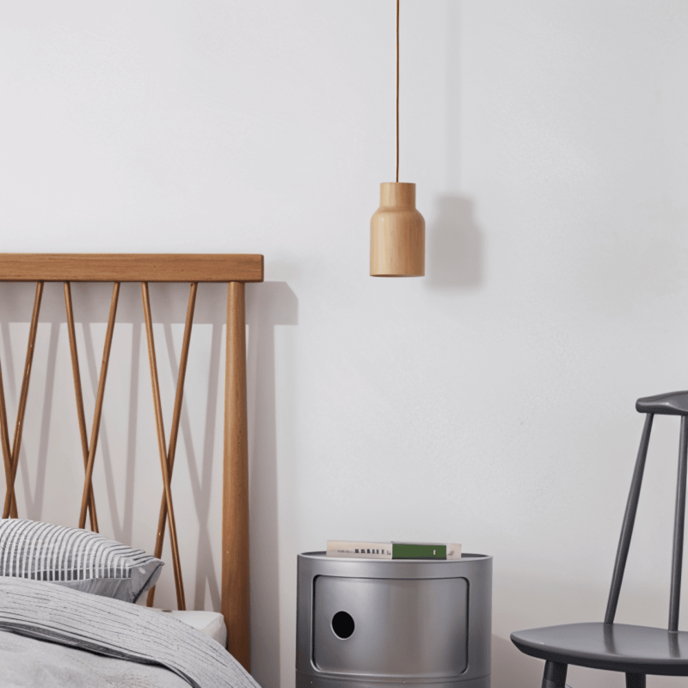 Plafonnier suspension design cylindrique, idéal pour une salle à manger ou un salon scandinave.