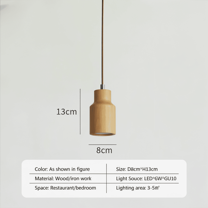 Suspension cylindrique élégante en bois clair, parfaite pour une ambiance scandinave et chaleureuse.
