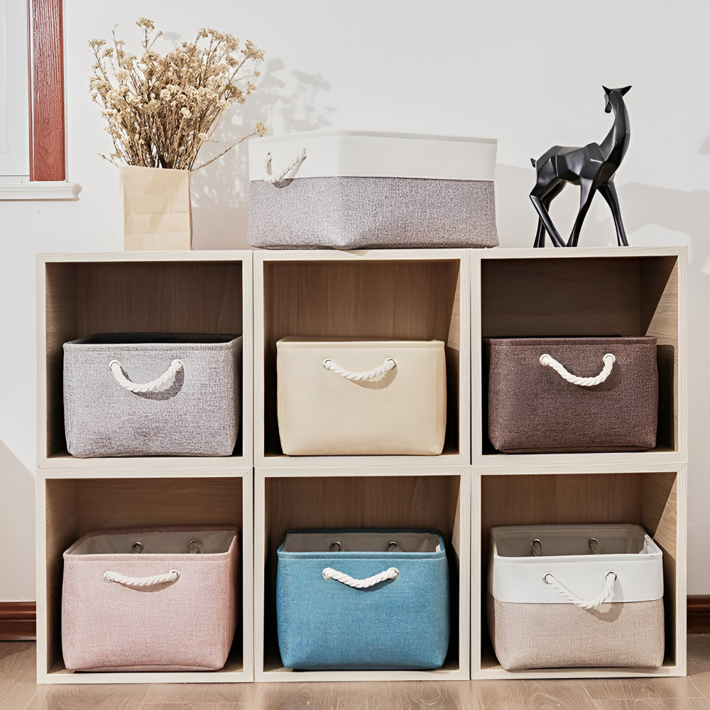 Panier de rangement élégant gris, pliable, parfait pour le linge ou comme solution de stockage décorative.