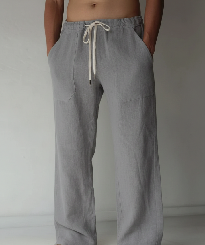 Pantalon respirant homme, taille élastiquée et cordon, coupe large tendance, idéal pour l'été.