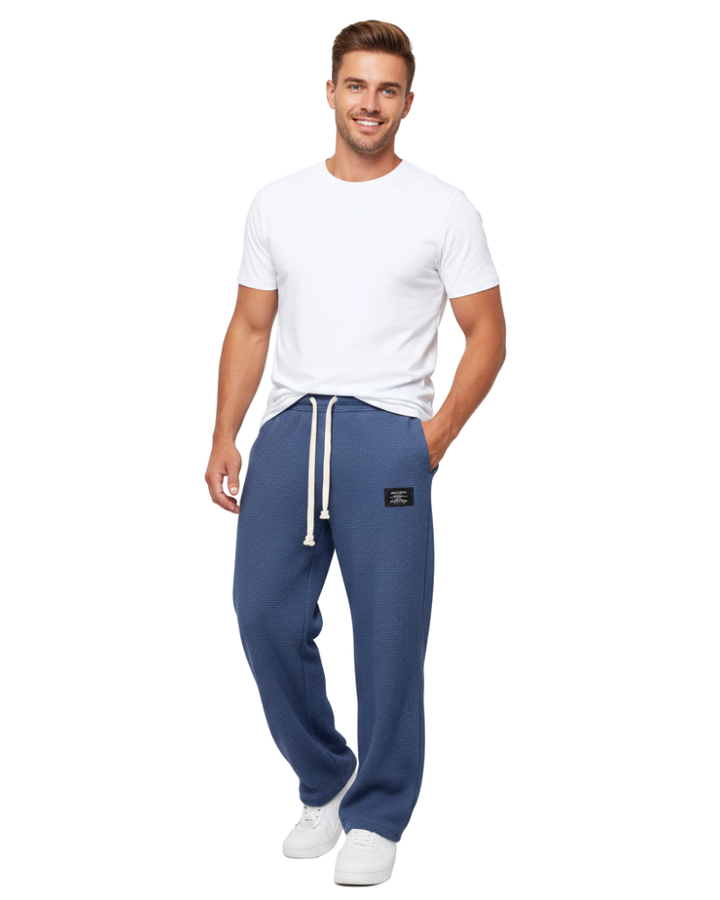 Pantalon homme doux et confortable, coupe ample moderne, avec taille ajustable.