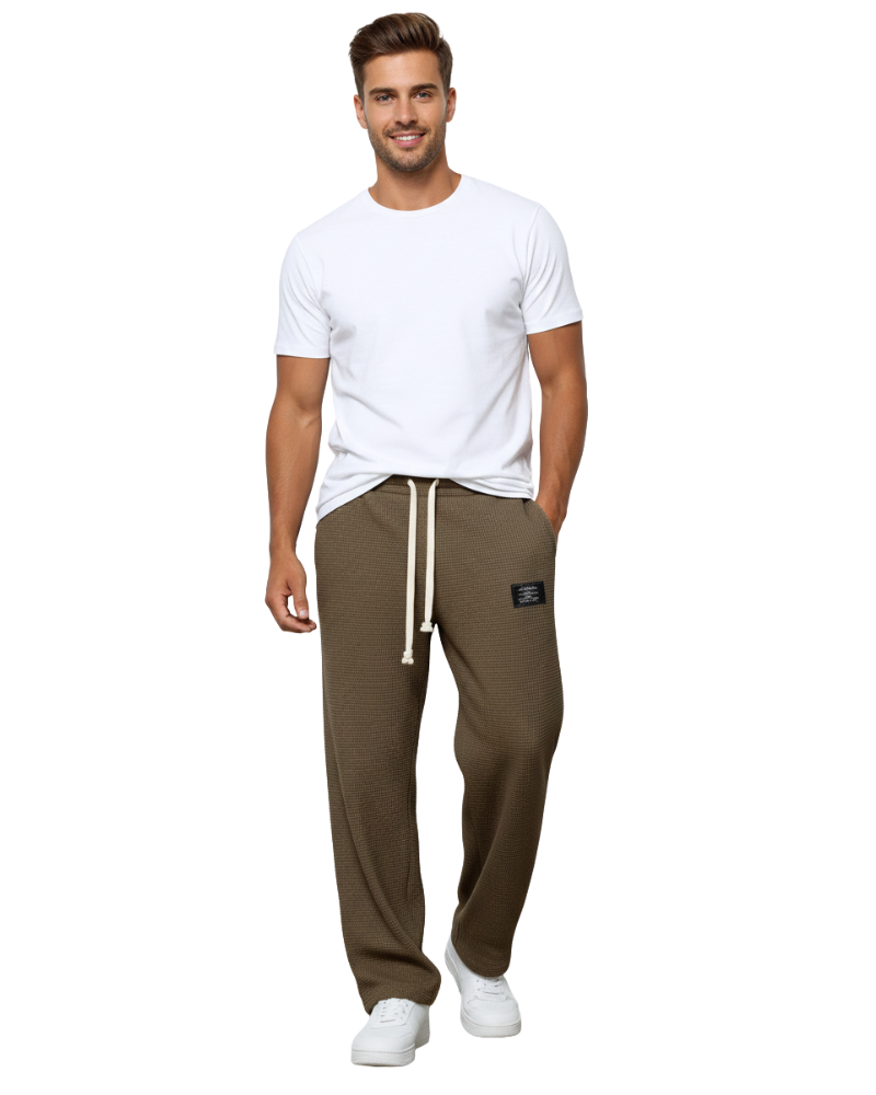 Pantalon homme moderne, coupe ample et confortable, taille ajustable pour un style décontracté et élégant.