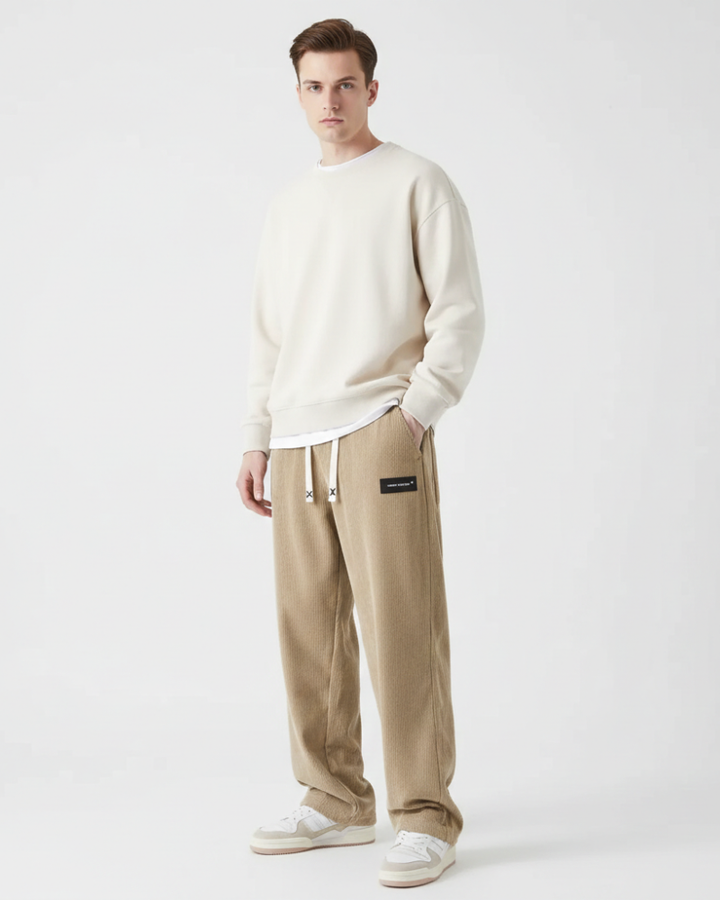Pantalon homme moderne et confortable, idéal pour l'automne/hiver. Tissu chaleureux, style décontracté et élégant.