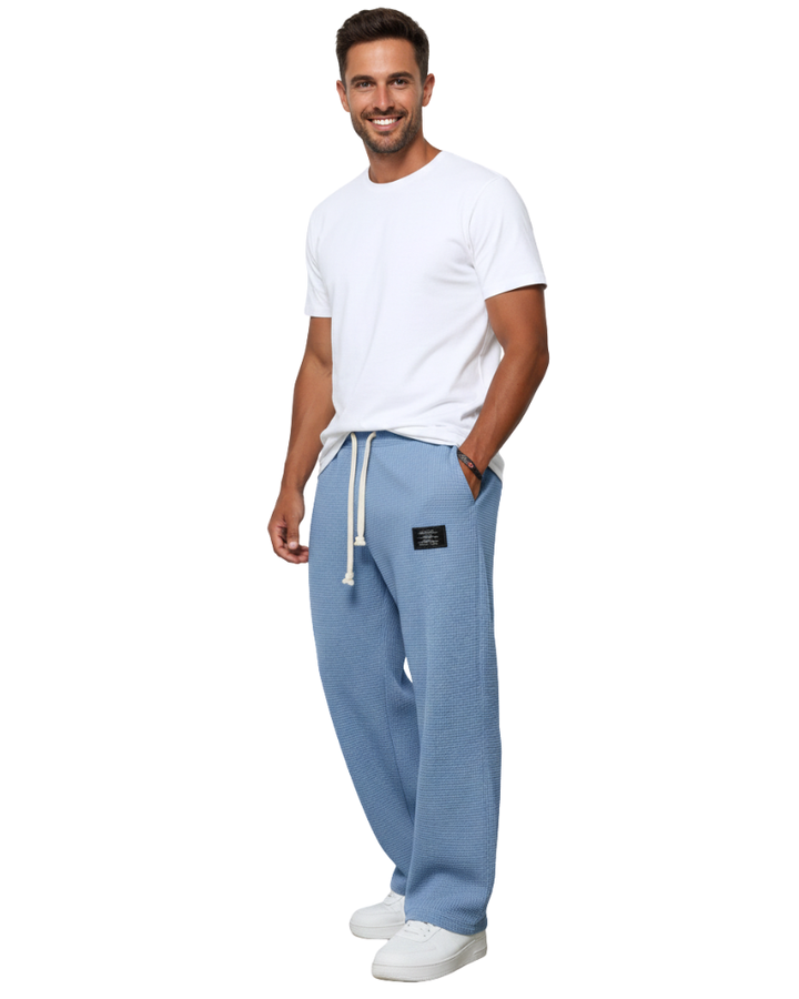 Pantalon homme ample, confortable et ajustable, idéal pour un style moderne et décontracté.
