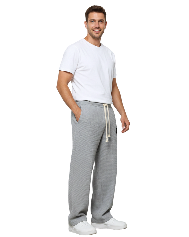 Pantalon élégant homme, coupe moderne et ample, parfait pour une allure décontractée chic.