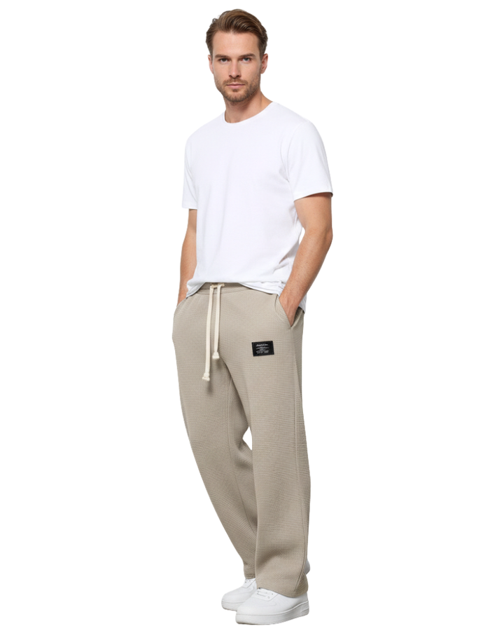 Pantalon homme ajustable avec cordon, coupe ample et confortable, pour un look moderne.
