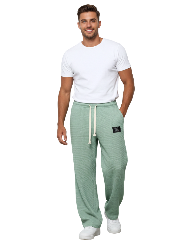 Pantalon homme décontracté mais élégant, coupe ample et ajustable, idéal pour diverses occasions.