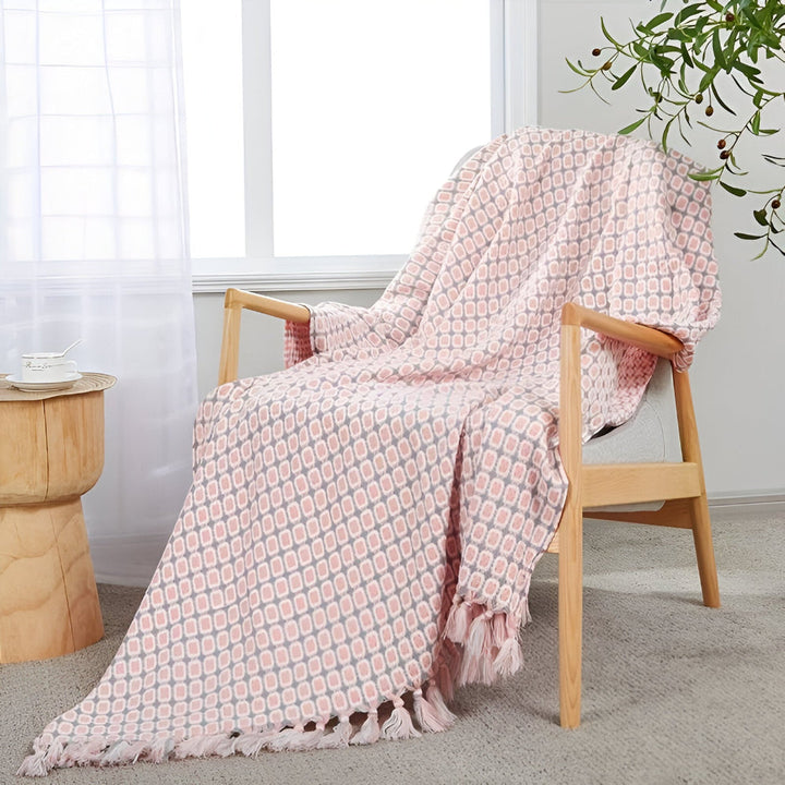 Plaid polaire vintage doux avec franges, idéal pour une décoration chaleureuse au salon ou chambre.
