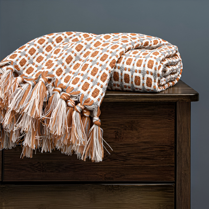 Jeté de lit polaire vintage avec franges, idéal pour réchauffer et décorer votre espace de vie.