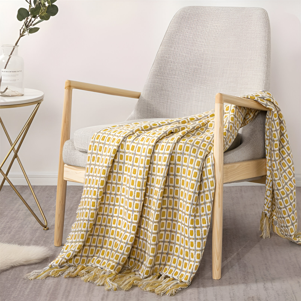 Couverture polaire légère et douce, style vintage avec franges, parfaite pour toutes saisons et décoration.