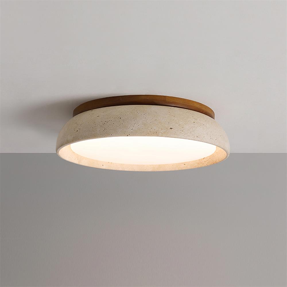 Lampe de plafond ronde en travertin installée, éclairant un intérieur élégant avec style.