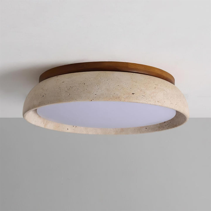 Éclairage LED rond en travertin, combine modernité et nature pour votre décoration.