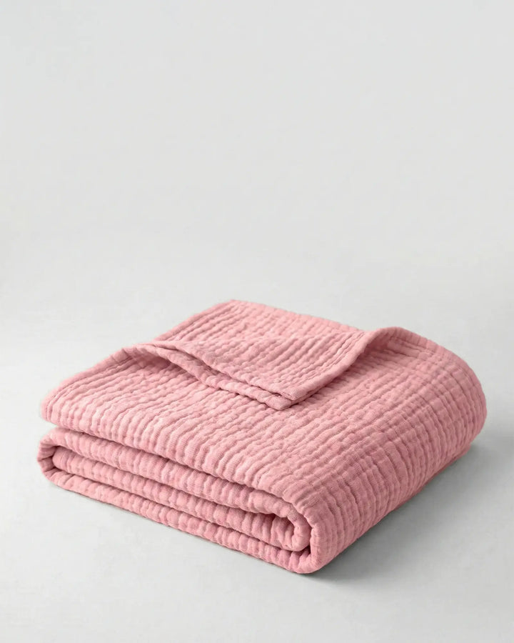 Plaid en coton mousseline, léger et respirant, idéal pour un ajout naturel à votre lit.
