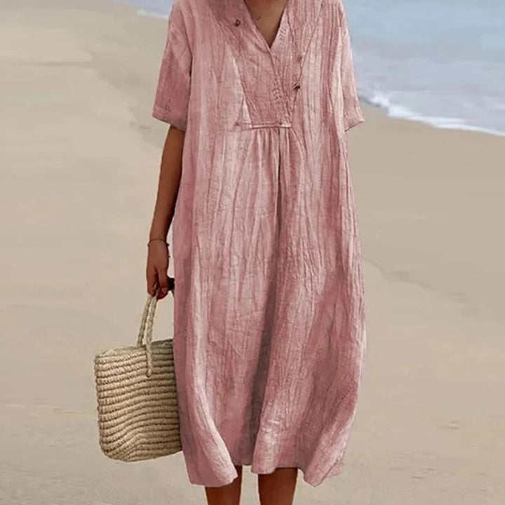 Détail du décolleté/manches de la robe midi femme, style décontracté mais élégant. Confort assuré.