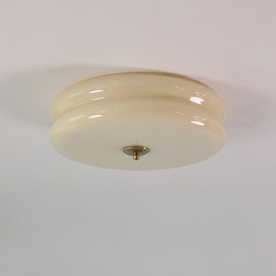 Plafonnier Art Déco avec motifs géométriques, finition sophistiquée. Design vintage et moderne stylé.