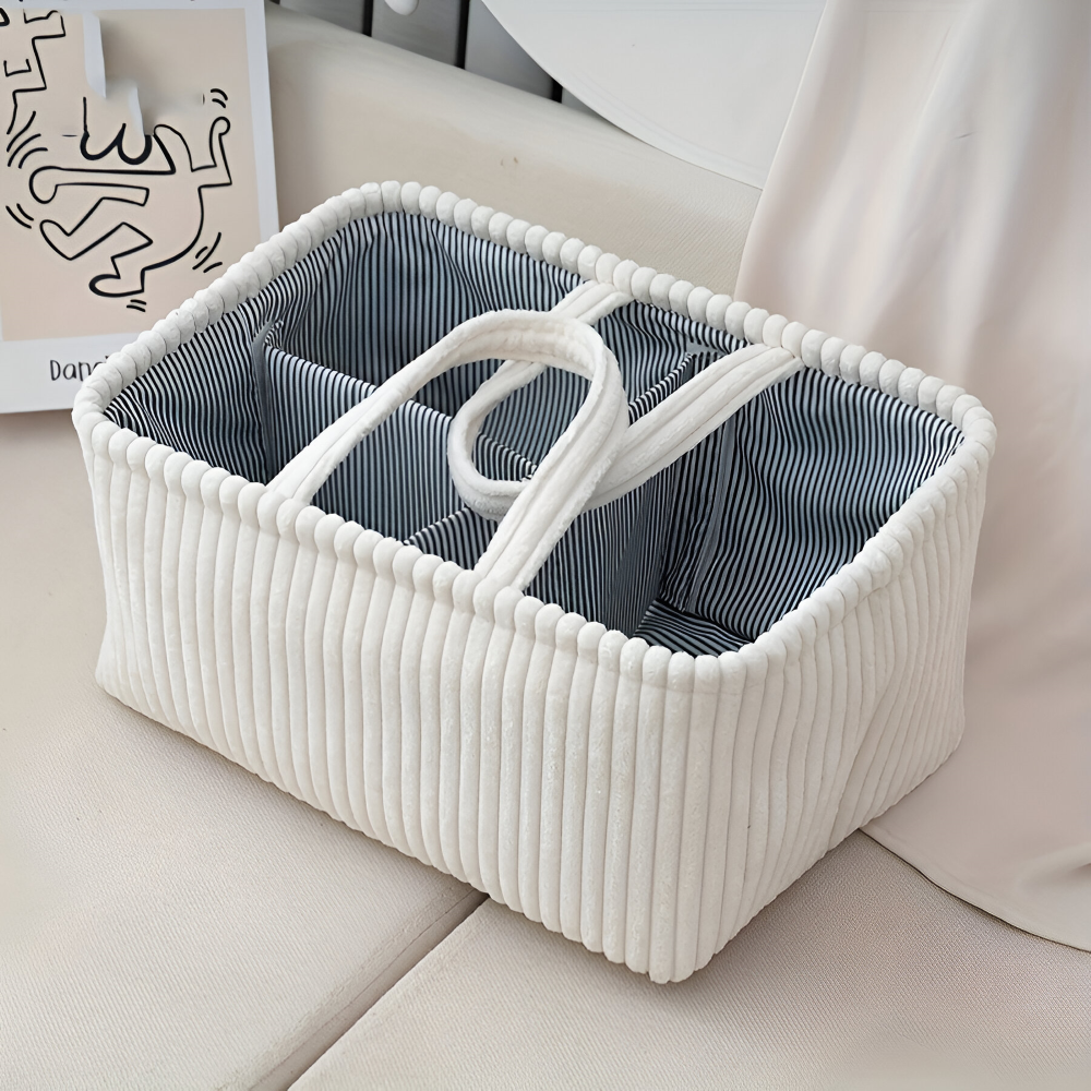 Panier de rangement bébé portable avec compartiments, organiseur de couches et accessoires pour déplacements ou maison.