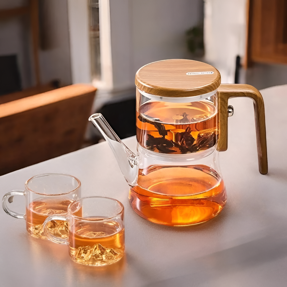 Théière moderne en verre transparent de 760ml avec filtre magnétique innovant et poignée en bois.