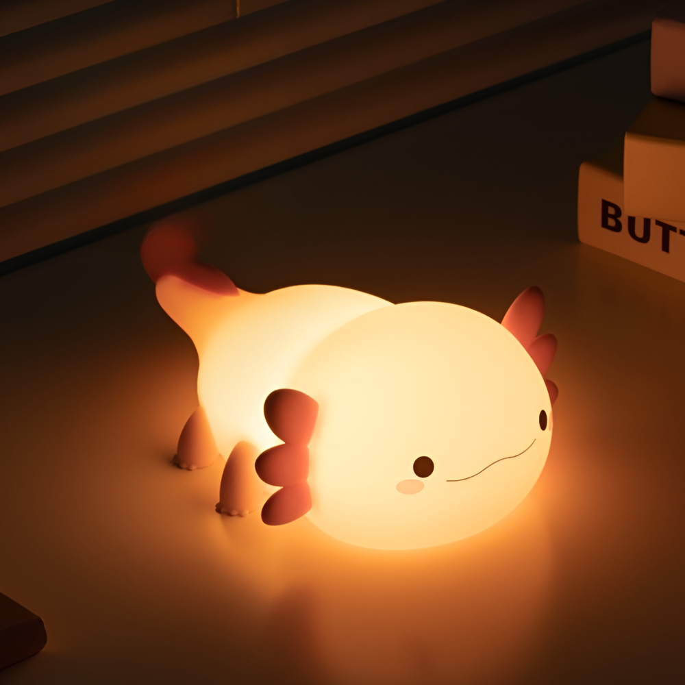 Lampe de nuit enfant en silicone forme axolotl, lumière LED douce rechargeable, parfaite pour chambre bébé.